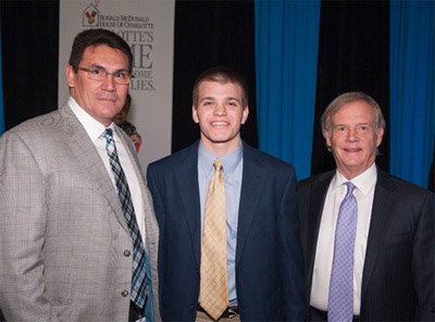 Panthers Coach Ron Rivera and Chuck Hood with the Student Athlete of the Month